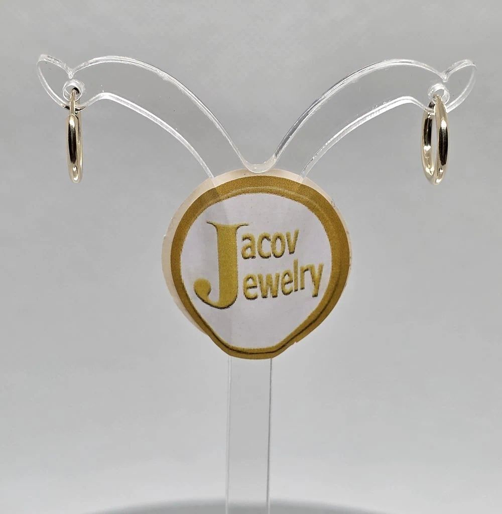 Pair of round hoop earrings, diameter 12 mm, 
in 14K yellow gold, new. Pair of flexible hollow 