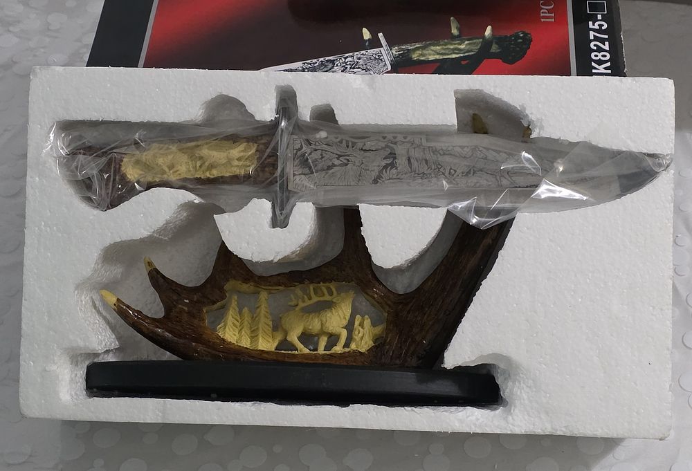 Stylized hunting knife on a deer antler stand perfect for a sideboard or office. Stock is 