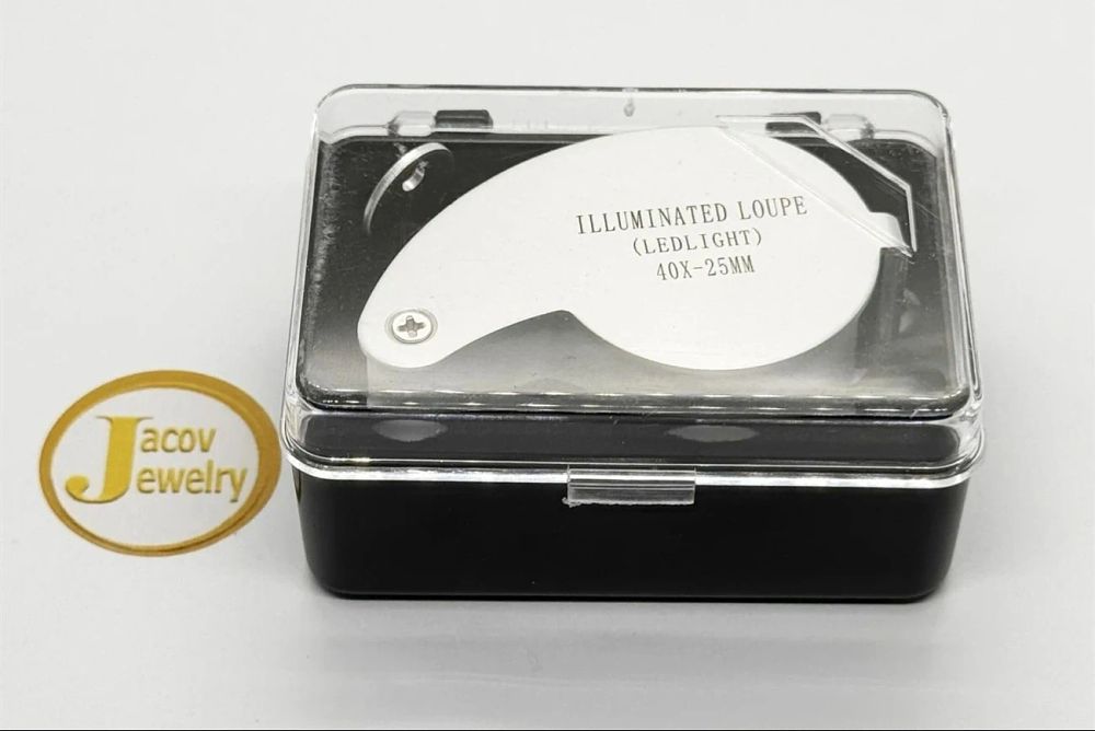 40x loupe in white and silver, includes lighting; new in box.... 40x Magnifying Loupe (White 