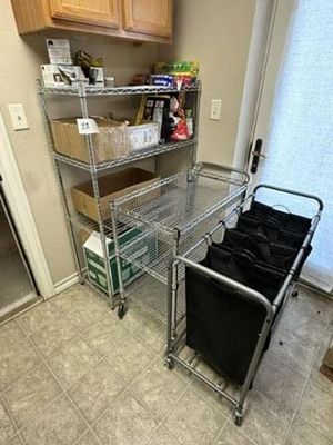 Garage Shelving Unit, Rolling Cart, Laundry Basket. Located In Lubbock, Tx