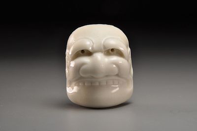 Netsuke/Нэцкэ Фарфоровая маска Буаку (Hirado porcelian). Япония, XIX век. 
Фарфор; 