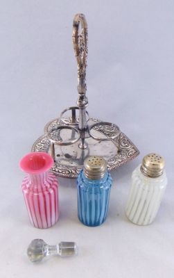 Opalescent condiment set. Three piece condiment set including a cranberry opalescent oil cruet