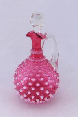Cranberry Hobb nail cruet. Cranberry Hobnail cruet with clear handle and faceted stopper, 7 1/2"