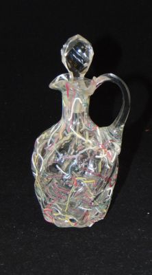 Vintage Peloton glass cruet. Clear swirled glass cruet decorated with colored shards,7" ht.