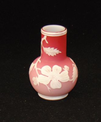 Webb cameo glass vase. Bulbous smoke stack form in Peachblow decorated with a cascading cameo