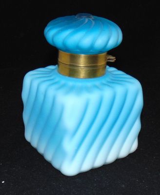 Victorian satin glass inkwell. Rectangular form in blue satin glass in a swirled pattern, clear