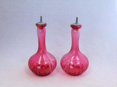 Pair of Cranberry Barber bottles. Bulbous stick form cranberry Barber bottles in a swirl pattern