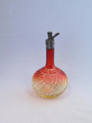 Baccarat Rose Tiente barber bottle. Baccarat barber bottle in a swirl Amberina Rose Tiente décor