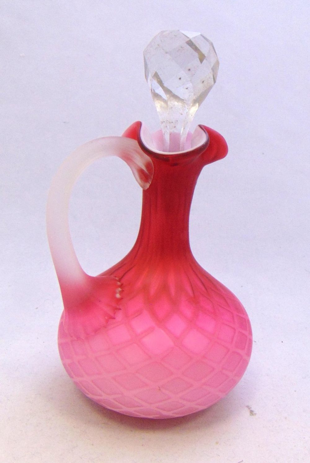 Lot 214: Pink MOP glass cruet