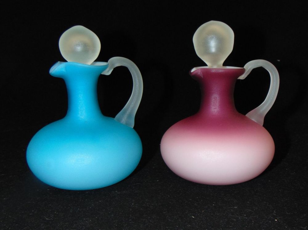 Lot 218: Two MOP glass cruet bottles