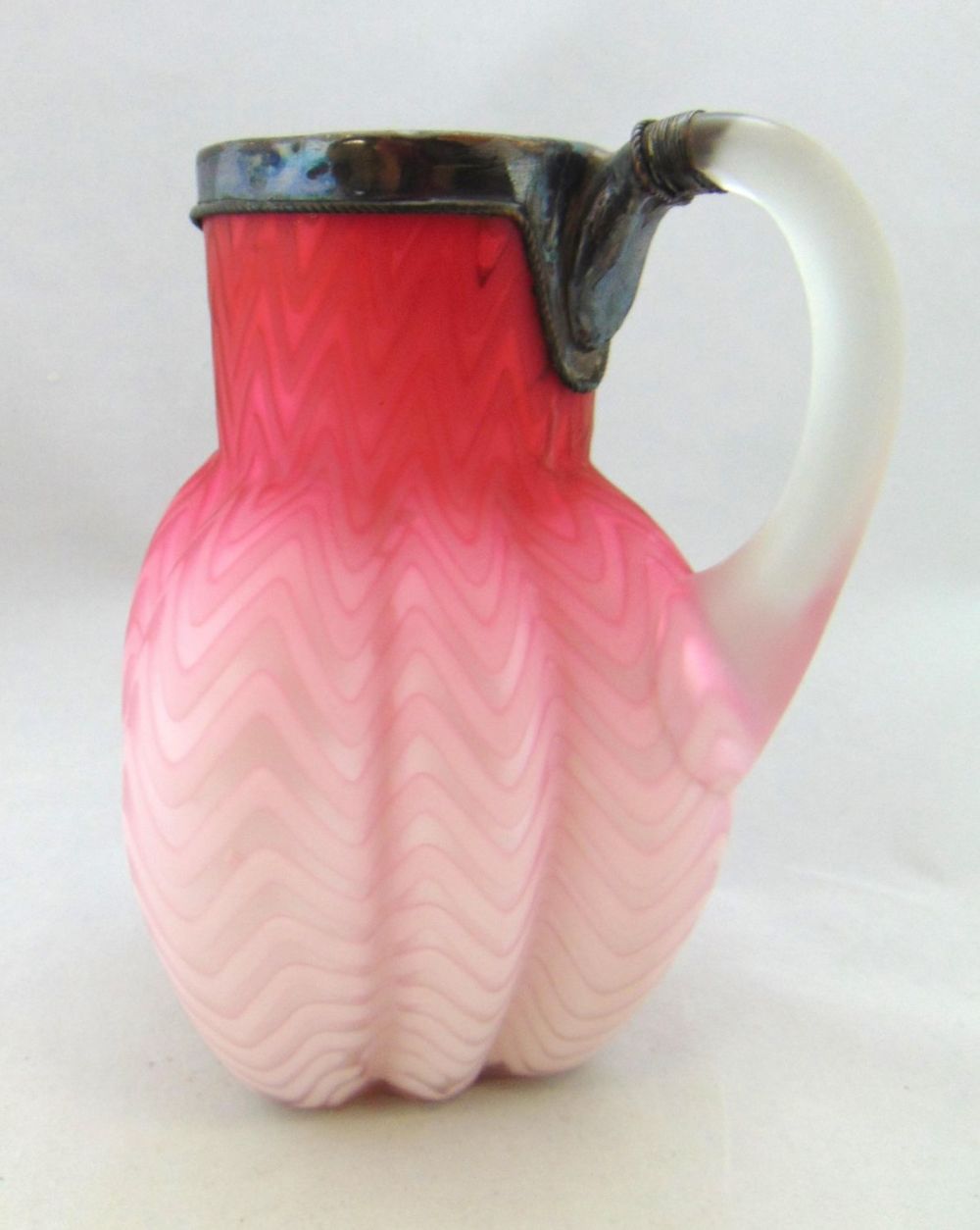 Lot 221: Pink MOP glass and metal pitcher