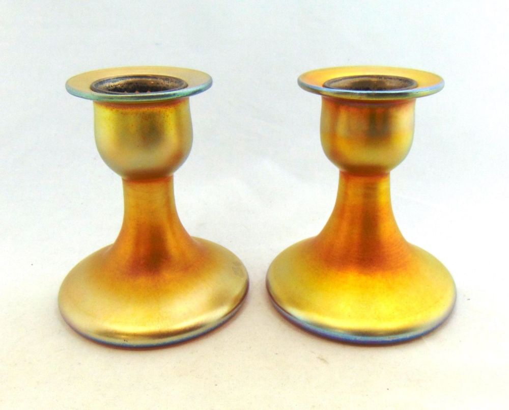 Lot 173: Pair gold Aurene candlesticks