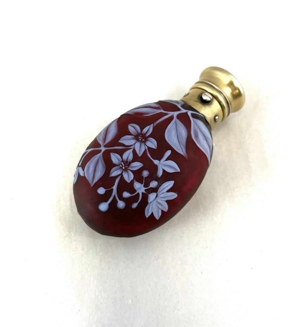 Lot 249: Red lay down cameo perfume