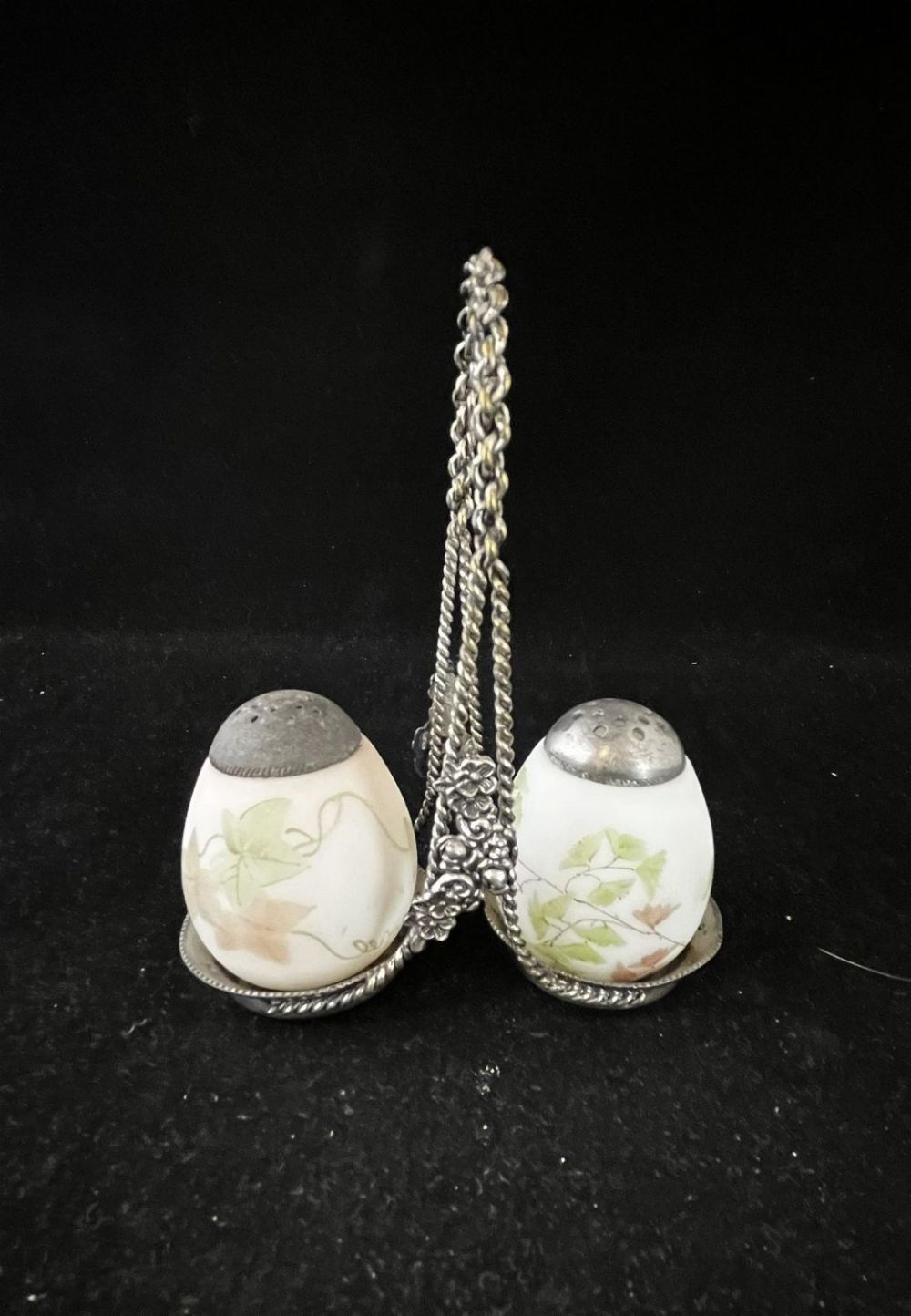 Lot 191: Pair of egg shakers with caddy