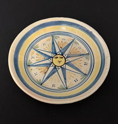 Quimper Deep Plate. Quimper French Faience deep plate with sun face; diameter 9". c. 19th 