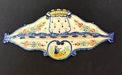 HR Quimper Pipe Rack. HR Quimper French faience pipe rack with Breton playing Bombarde; length 