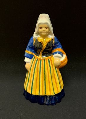 HenRiot Quimper Figurine. HenRiot Quimper Andre Galland figurine of Bretonne with basket; ht 7 