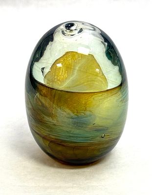 John Lewis Egg Paperweight. John Lewis egg form paperweight with wisps of green and opalescent 