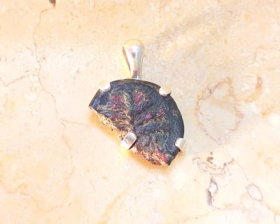 Silver pendant with original fraction of bronze coin of Shim’on Bar Cochba, 132-135 C.E. Some 