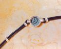 Leather bracelet with original "Widow's Mite" coin, 103-76 B.C.E. From archaeological Image - 2