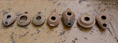 שבעה נרות חרס. Lot of seven terracotta lamps, Roman, Byzantine, Samaritan, ca. 2nd-6th century. 