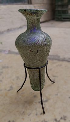 כלי זכוכית עתיקה. Conical bottle, with body tapering downwards; pushed in base with pontil mark; 