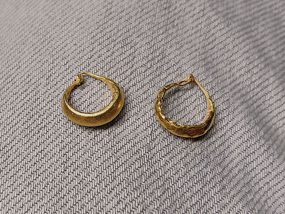 Pair of gold earrings on wax core; diam 1.3 cm; 1.0 grams. Roman; Professor Rachel Milstein 