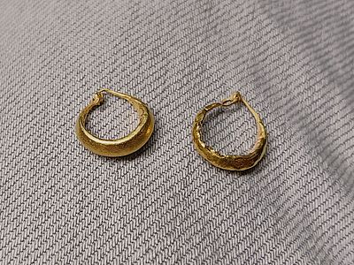 Pair of gold earrings on wax core; diam 1.3 cm; 1.0 grams. Roman; Professor Rachel Milstein 