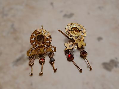 Two gold earrings, openwork floral design; both 1.9 cm; 3.5 grams. Roman; Professor Rachel 