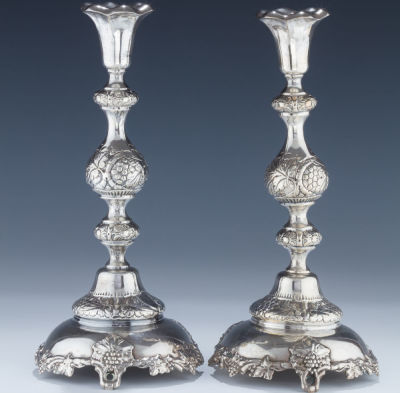 A Pair of Large Silver Candlesticks. A PAIR OF LARGE SILVER CANDLESTICKS. Warsaw, c. 1890. On 