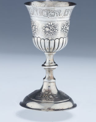 A Silver Kiddush Goblet. A SILVER KIDDUSH GOBLET. Germany, c. 1910. On round base decorated with 