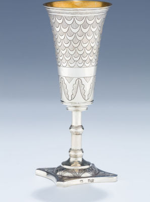 A Large Silver Kiddush Goblet. A LARGE SILVER KIDDUSH GOBLET. Poland, c. 1820. On stylized 