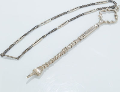 A Silver Torah Pointer. A SILVER TORAH POINTER. Morocco, c.1880. With handmade chain. Upper 