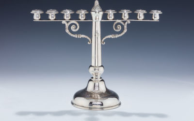 A Silver Hanukkah Menorah. A SILVER HANUKKAH MENORAH. Germany, c. 1880. On round base with 