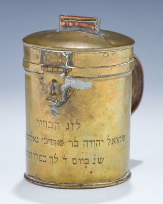 A Brass Charity Container. A BRASS CHARITY CONTAINER. Probably USA, 1935. With handle. Engraved 