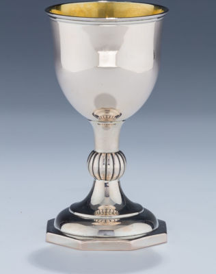 A Silver Kiddush Goblet. A SILVER KIDDUSH GOBLET. Poland, c. 1820. On eight sided base with 