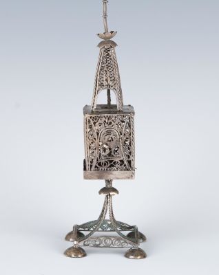 A SILVER SPICE CONTAINER. Vienna, c. 1900. On four cupped feet. With filigree body. 6.7" tall.