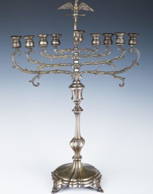 A LARGE STERLING SILVER MENORAH. Probably Israel, c. 1990. On four feet. Chased with scrolling 