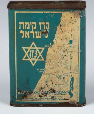 A JNF CHARITY BOX. Israel, c. 1980. The front decorated with a map of Israel, JNF logo and 