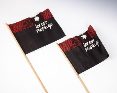 28. TWO SOVIET JEWRY FLAGS. New York, c. 1979. Each one asking to let our people go (emigrate 