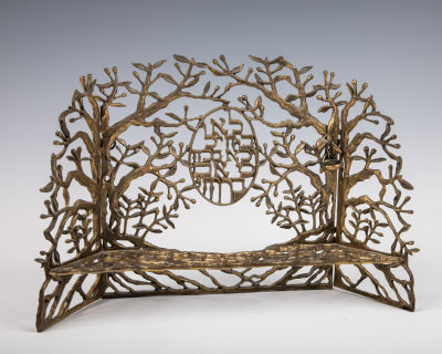 45. A BRUTALIST BRASS MENORAH BY FARREN. American, 20th century. With glass inserts. 13.5” wide.