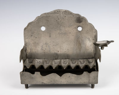 49. A PEWTER HANUKKAH LAMP. Germany, 19th century. On four legs with marked cut out backplate. 