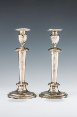 18. A PAIR OF EARLY SILVER SABBATH CANDLESTICKS. Poland, c. 1920. Each is on a round base with 
