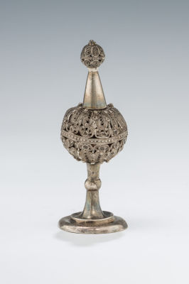 30. A SILVER SPICE CONTAINER. Continental, 19th century. The solid silver base is engraved in 