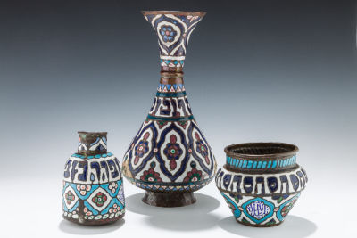 35. A GROUP OF THREE ENAMELED DECORATIVE VASES. Persian, c. 1900. Each one hand wrought copper 