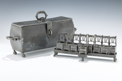 36. A PEWTER HANUKKAH LAMP. Germany. It is composed of eight chairs, each with a wick holder. 