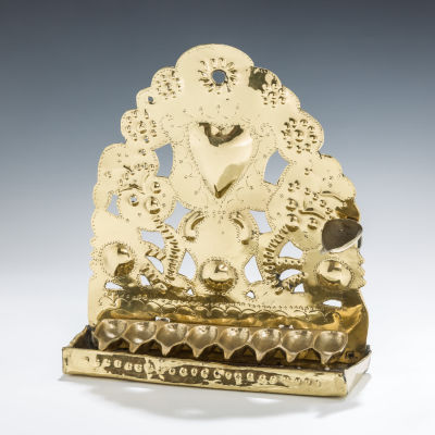 38. A BRASS HANUKKAH LAMP. The Netherlands, 19th century. The back plate is chased with floral 