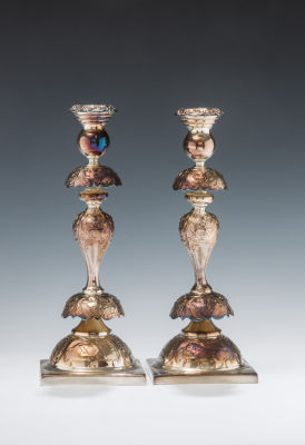 40. A PAIR OF JUDAIC SABBATH CANDLESTICKS. Warsaw, c. 1890. Each one has a square base 