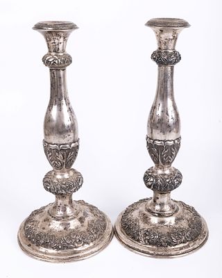 A LARGE PAIR OF SILVER SABBATH CANDLESTICKS. Brno, c. 1860. On round bases chased with flora 