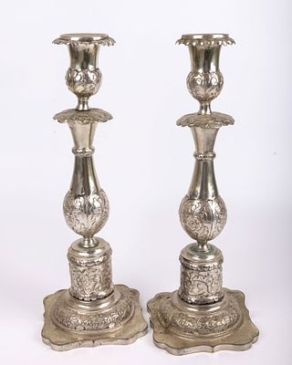 A LARGE PAIR OF SILVER SABBATH CANDLESTICKS.Russian, c. 1860. On stylized square bases engraved 
